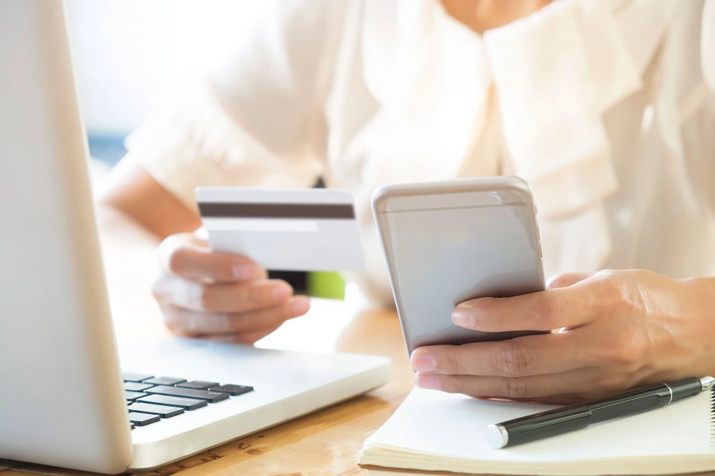 Person making an online payment with a credit or debit card