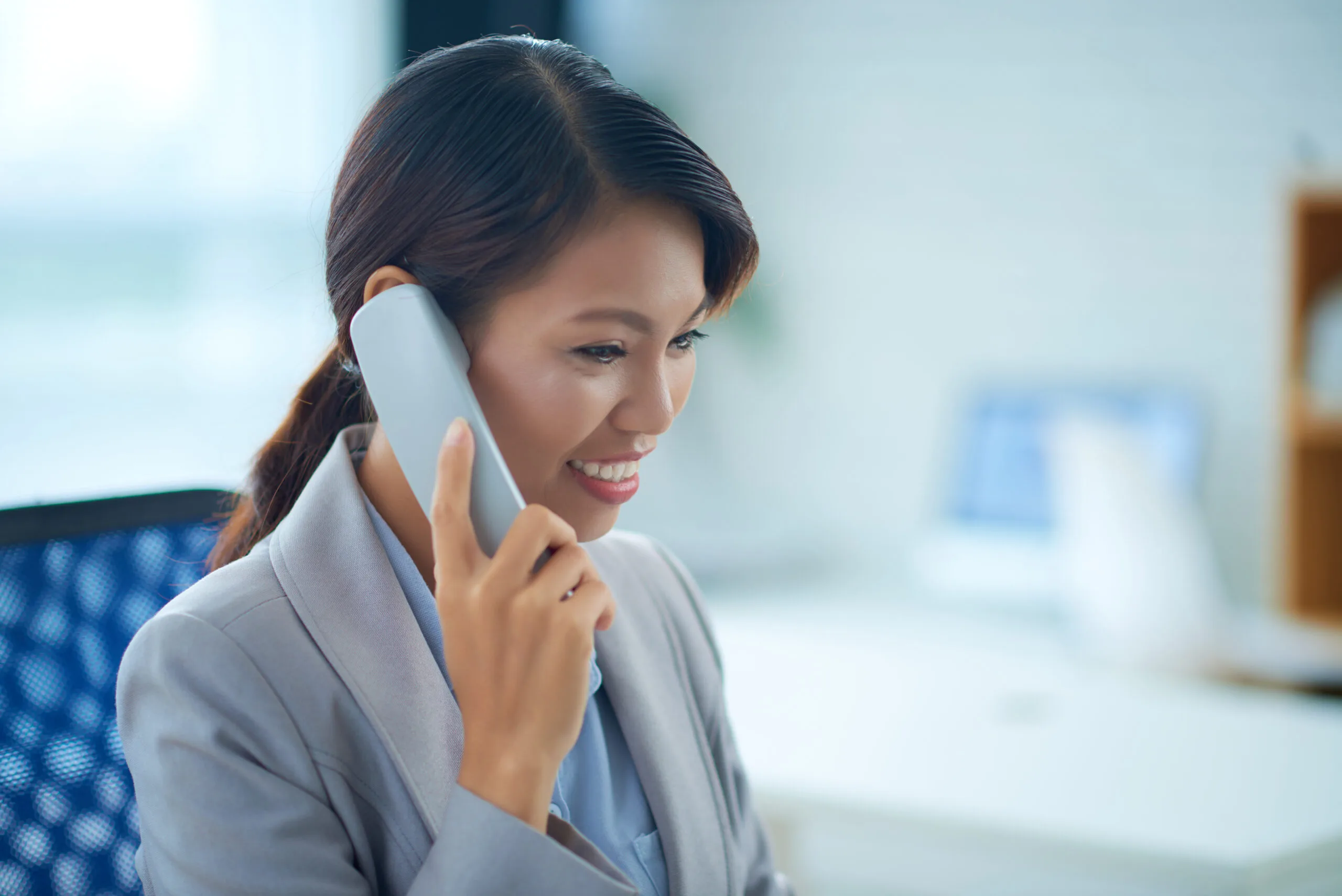 Woman calling to book a free consultation for Singapore accounting and tax services
